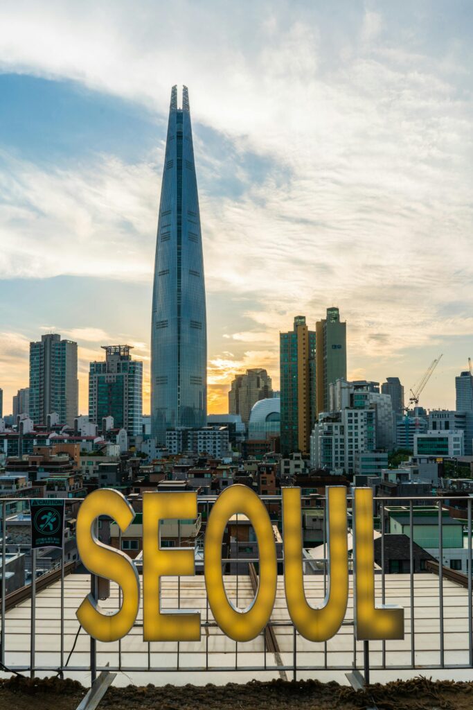 South Korea: The "N-Po Generation" Mindset Stunning view of Lotte Tower and Seoul's skyline during sunset, highlighting the city's urban architecture.