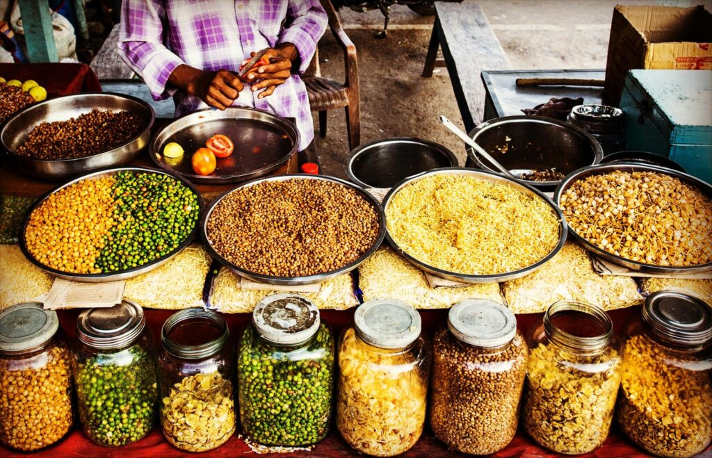 How My Summer in India Changed How I Think About Money Colorful display of spices and legumes in a traditional Indian street market.